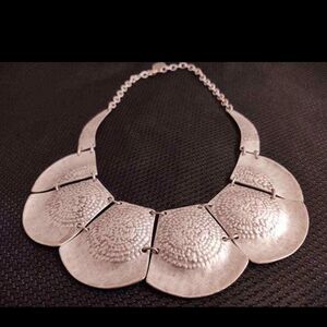 Vintage hammered aluminum? necklace; hinges slats, forge emblem?